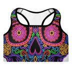 Colorful sugar skull design sports bra on a white background