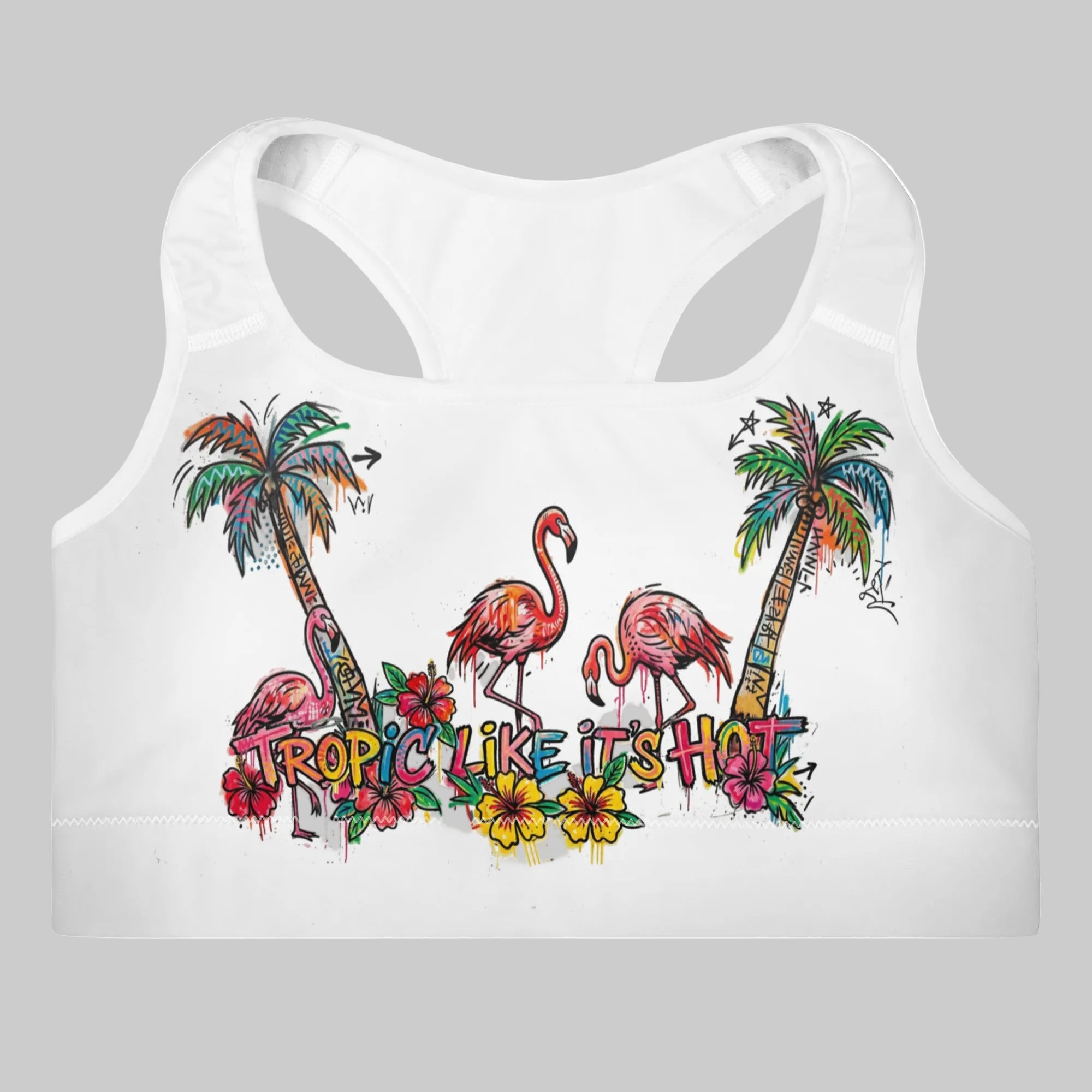 Tropical sports bra featuring flamingos and palm trees on a white background